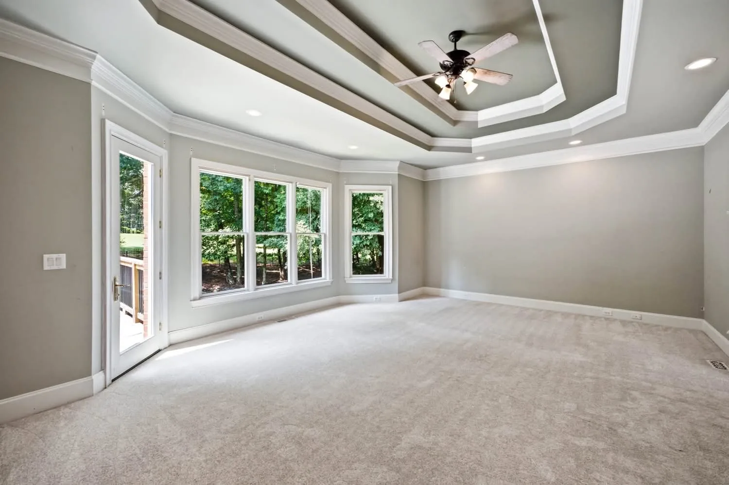 Owner's suite at 2115 Tee Drive, a spacious master bedroom with elegant finishes in Chateau Elan