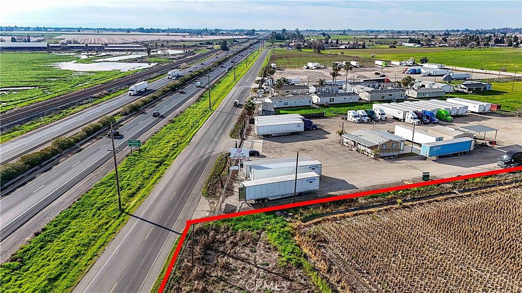 Expansive view of the 24.5-acre property with distant hills in Merced CA
