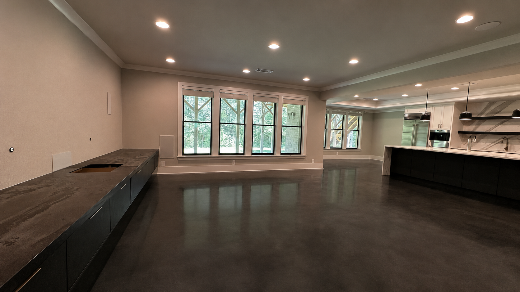 Large open-concept room at 5760 Lula Bridge Ct with dark built-in cabinetry