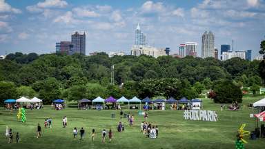 Dorothea Dix Park event with Downtown Raleigh skyline