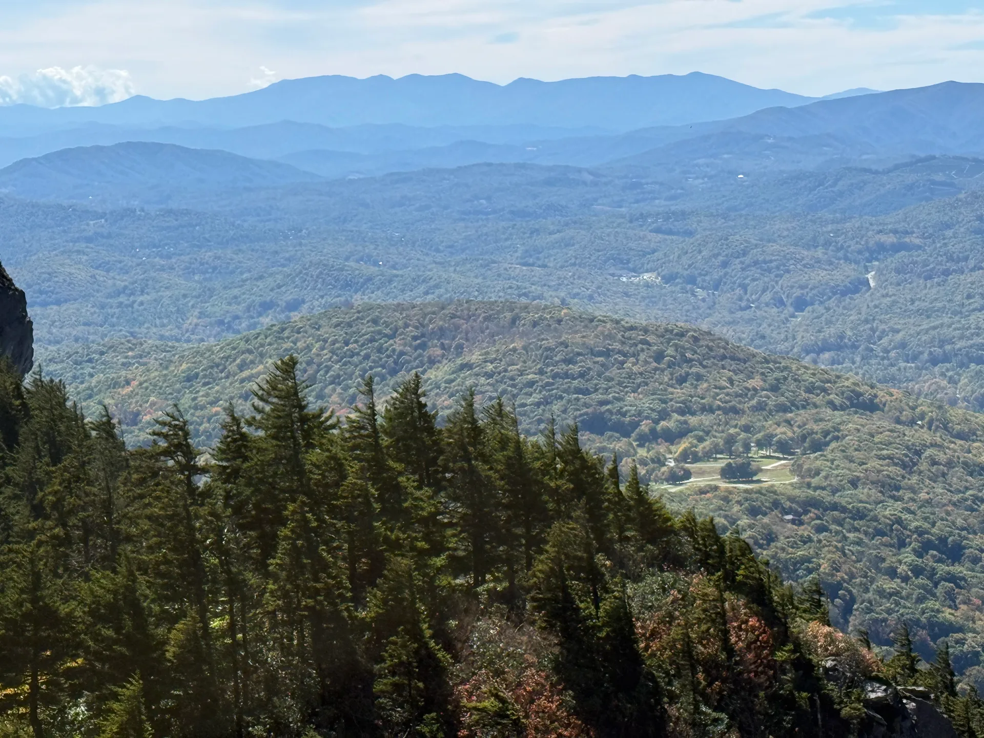 An evergreen ridge dropping over a forested valley near Linville Gorge