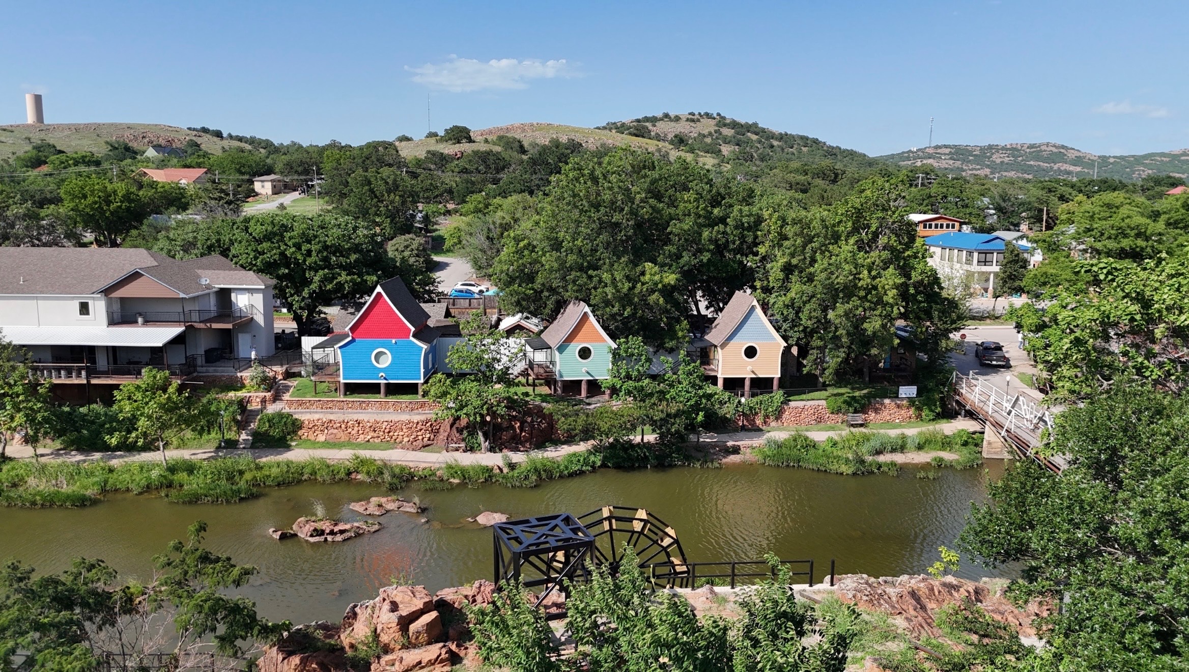 Colorful A-frame vacation cabins along the creek in Medicine Park, Oklahoma