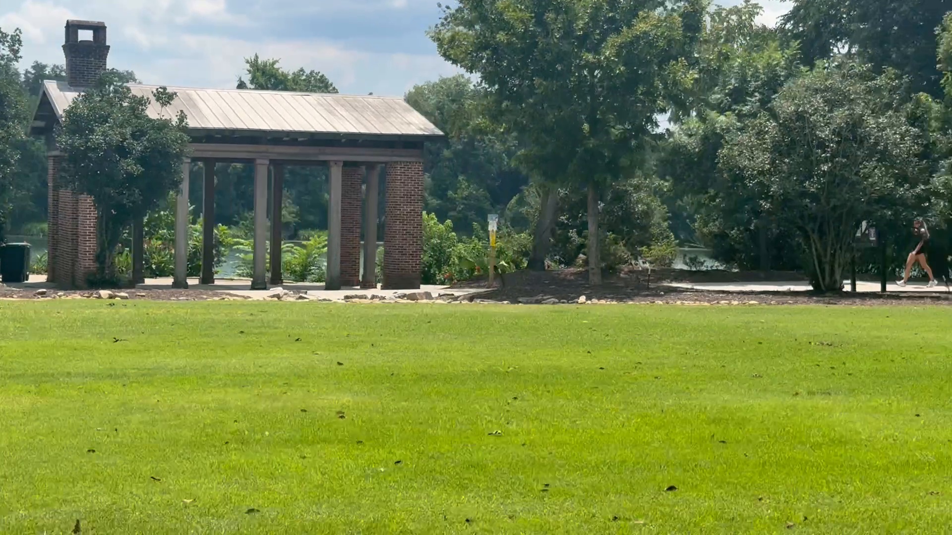 Boeckh Park in Hammond's Ferry with its brick pavilion and riverside lawn