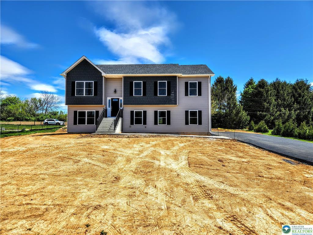 3307 Kennedy Drive exterior front view, a stunning custom-built home in Allen Township