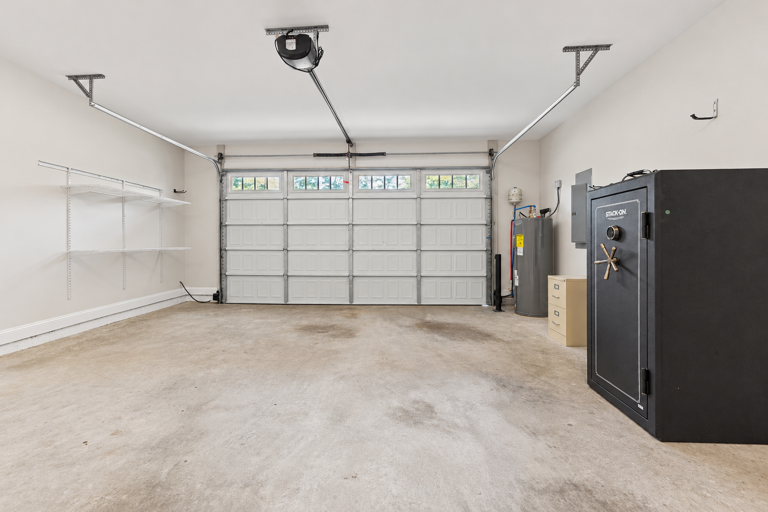 Bright neutral two-car garage interior at 1537 Dartmouth Dr, Auburn AL