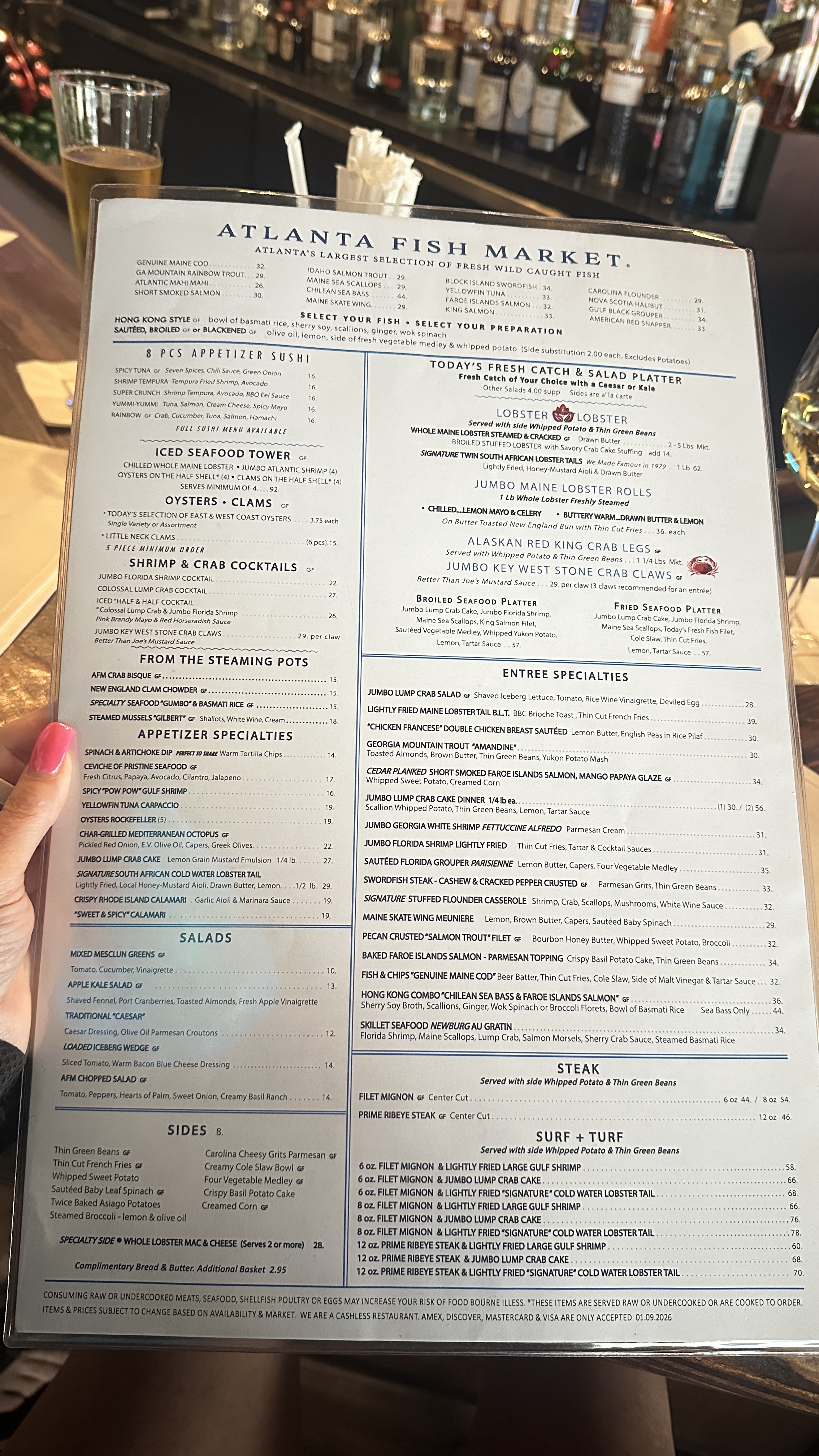 Atlanta Fish Market menu on the table with bar setting at this popular Atlanta seafood restaurant