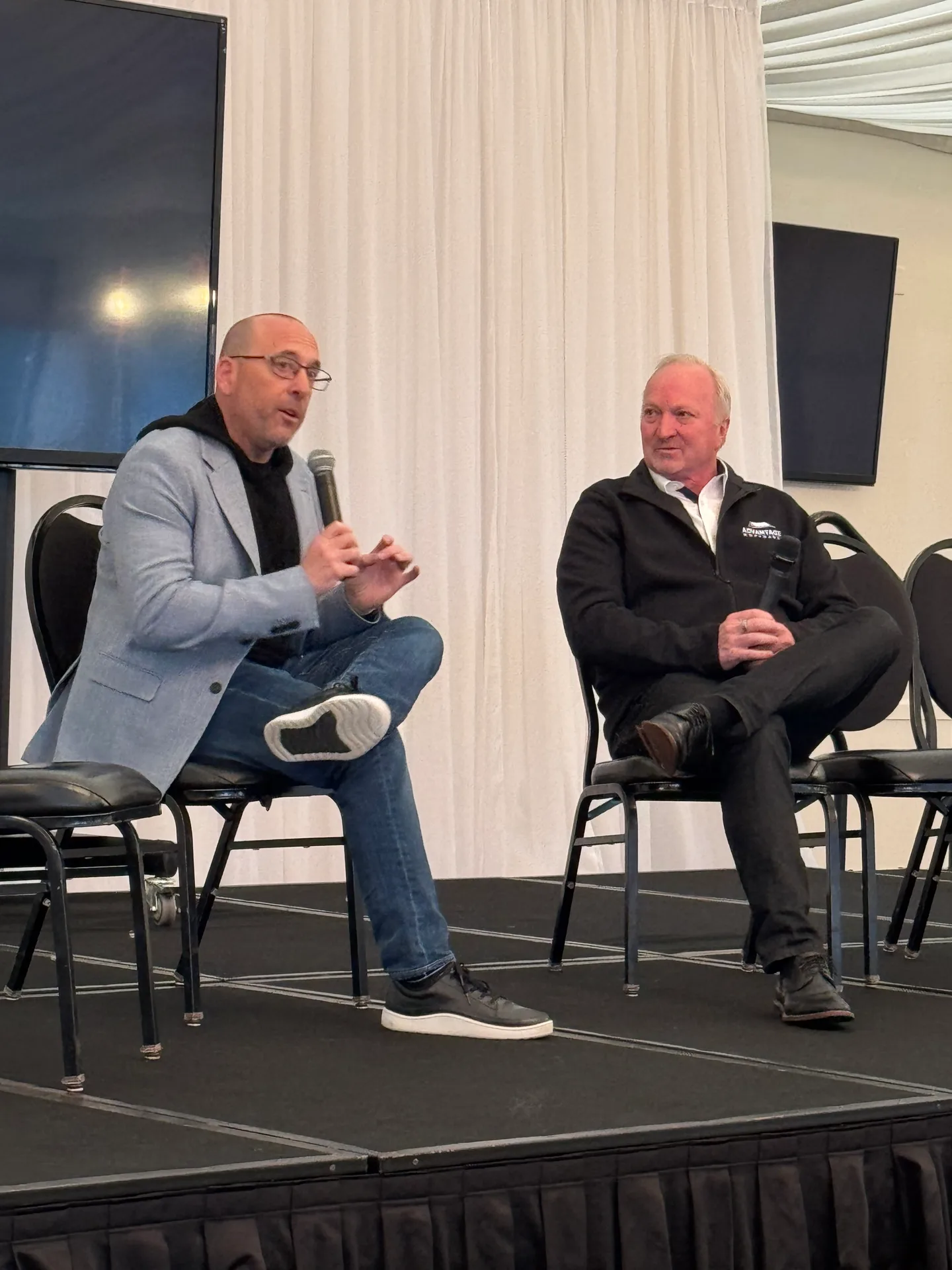 Craig Davis in a sit-down conversation on stage at Advantage Mortgage