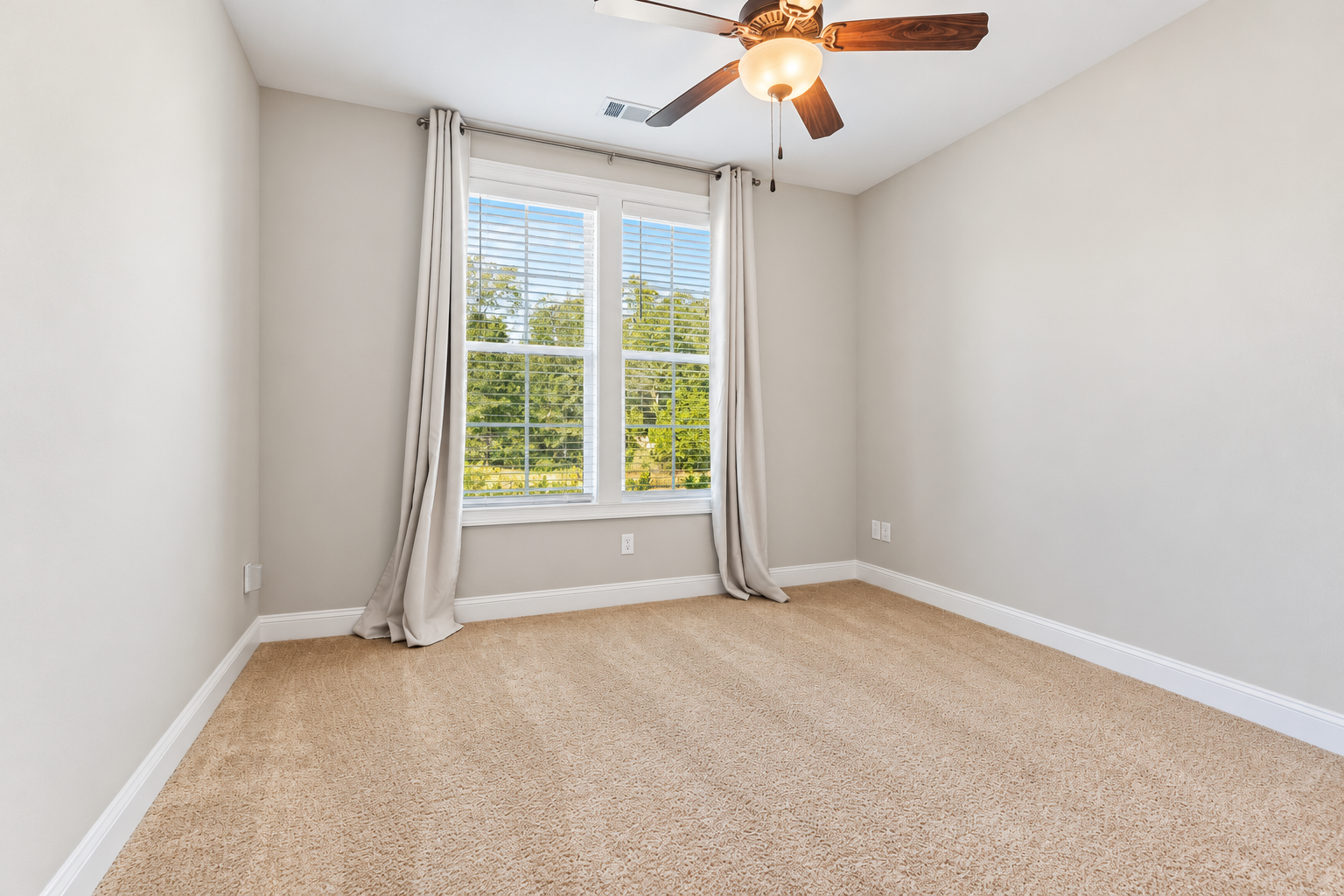 Bright minimal bedroom at 1537 Dartmouth Dr, Auburn AL