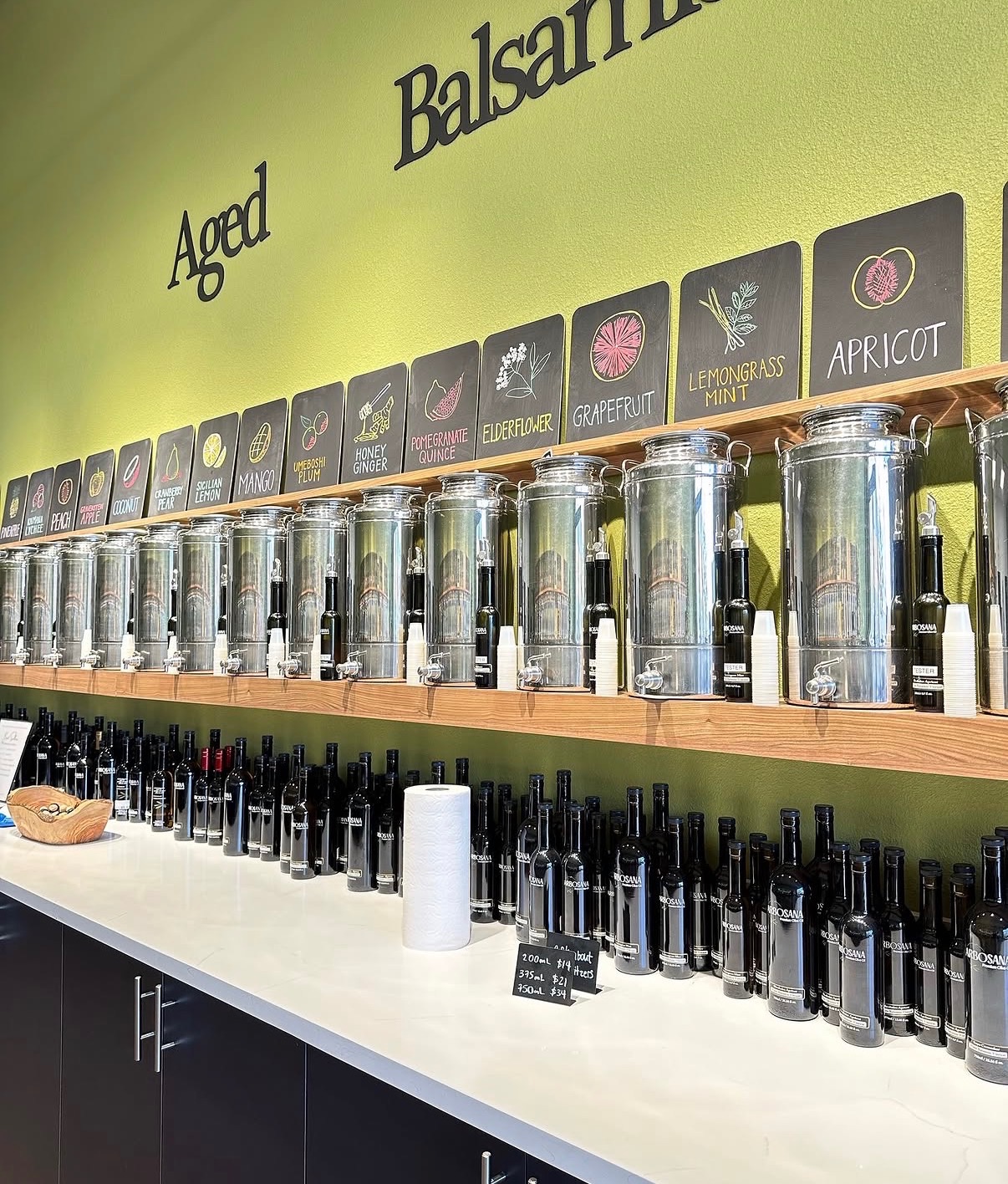 Flavor selection display at Arbosana Olive Oil showcasing a variety of oils and vinegars