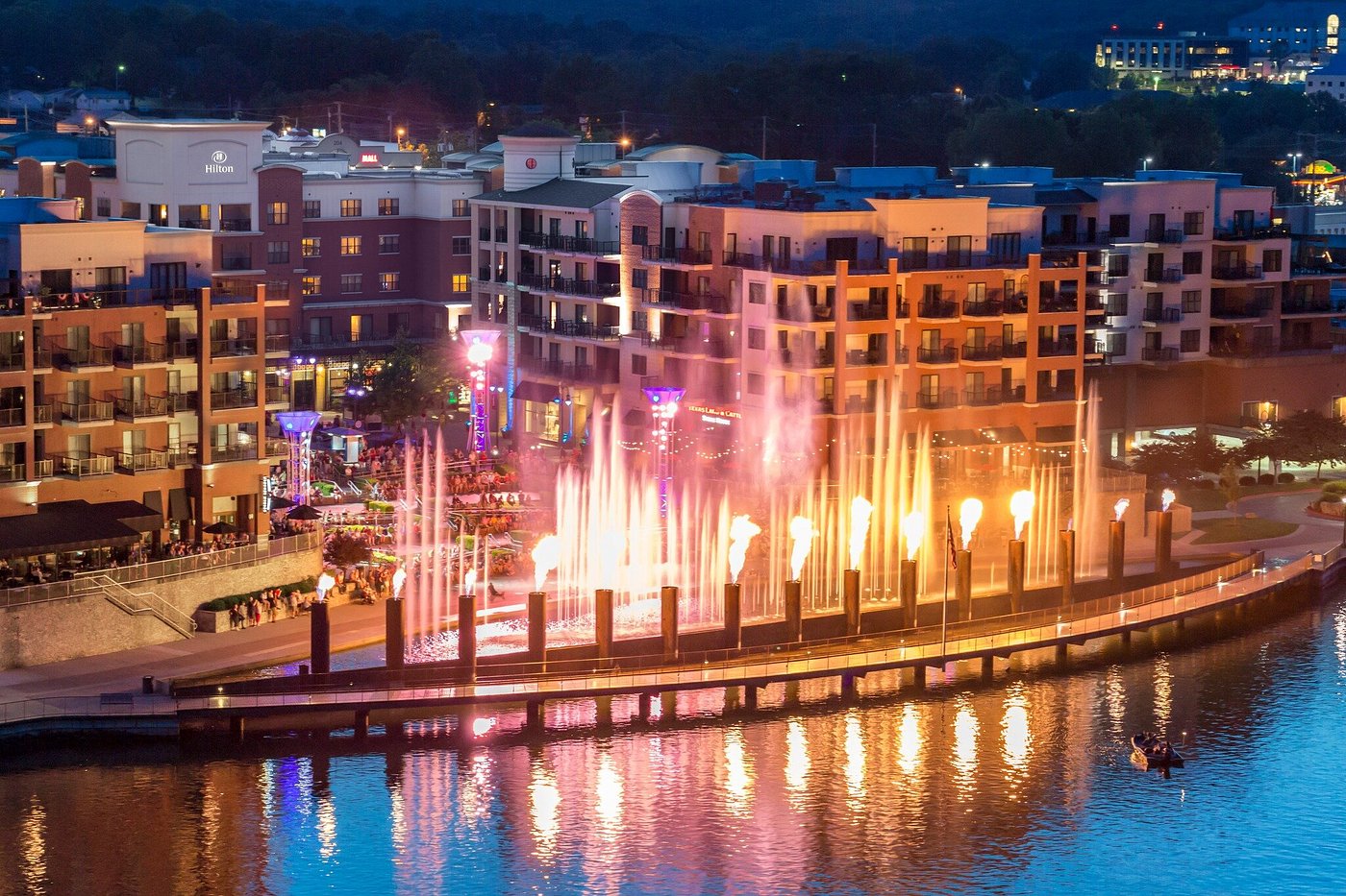 The Branson Landing fountain shooting colorful water over the lakefront promenade in Branson, Missouri