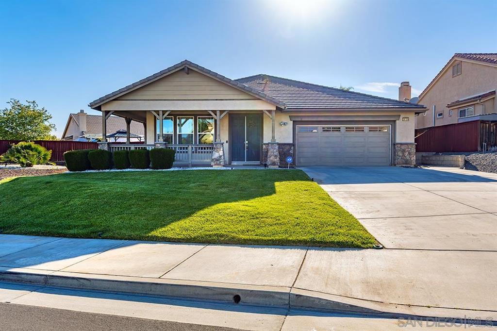 Single-family home in Murrieta Oaks with mature landscaping and an established suburban streetscape