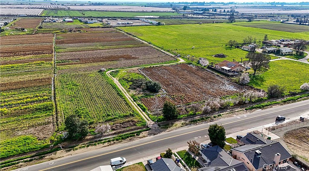 Panoramic view of the rural acreage with tree lines in the distance