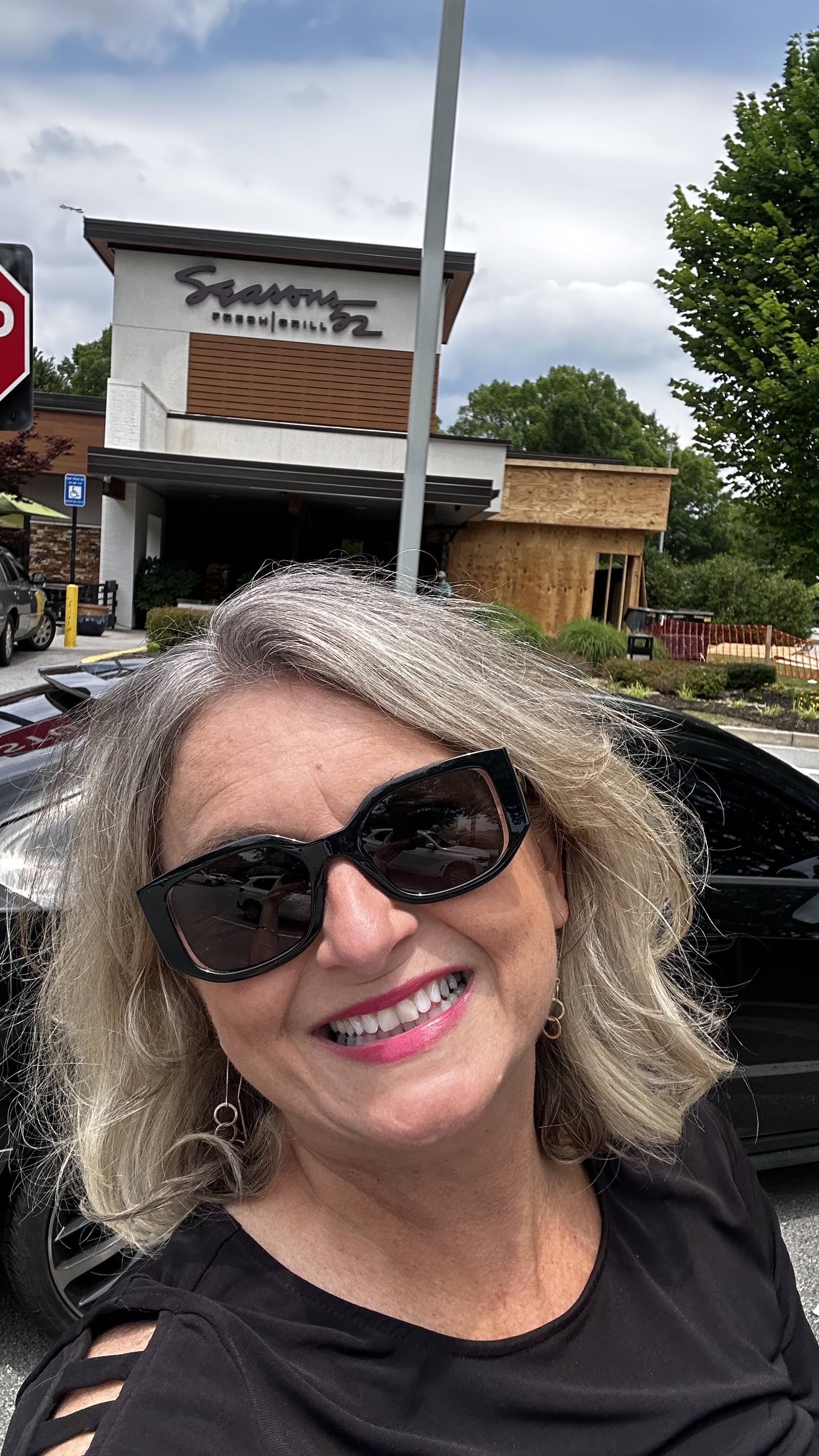 Lisa Harris at Seasons 52 restaurant exterior in Buford Georgia