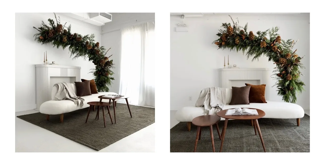 A lounge vignette at The Nook Studio with a floral fireplace installation