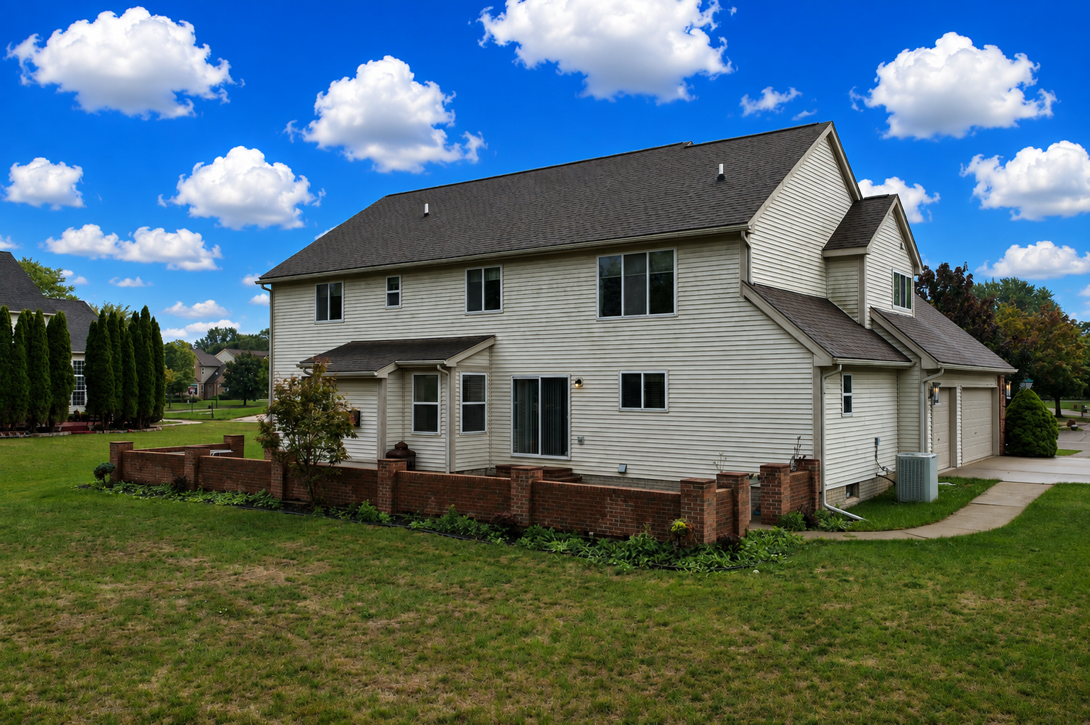 Back of home and patio at 2295 Hidden Forest Drive, Grand Blanc, Michigan