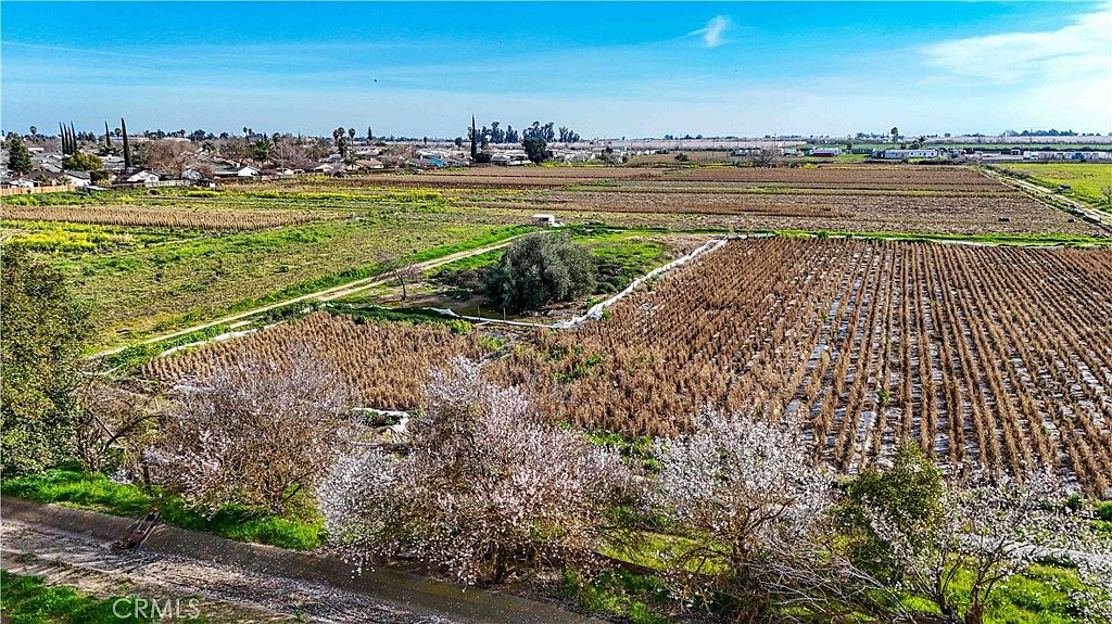 Open agricultural field on the 2577 Lobo Ave property during growing season