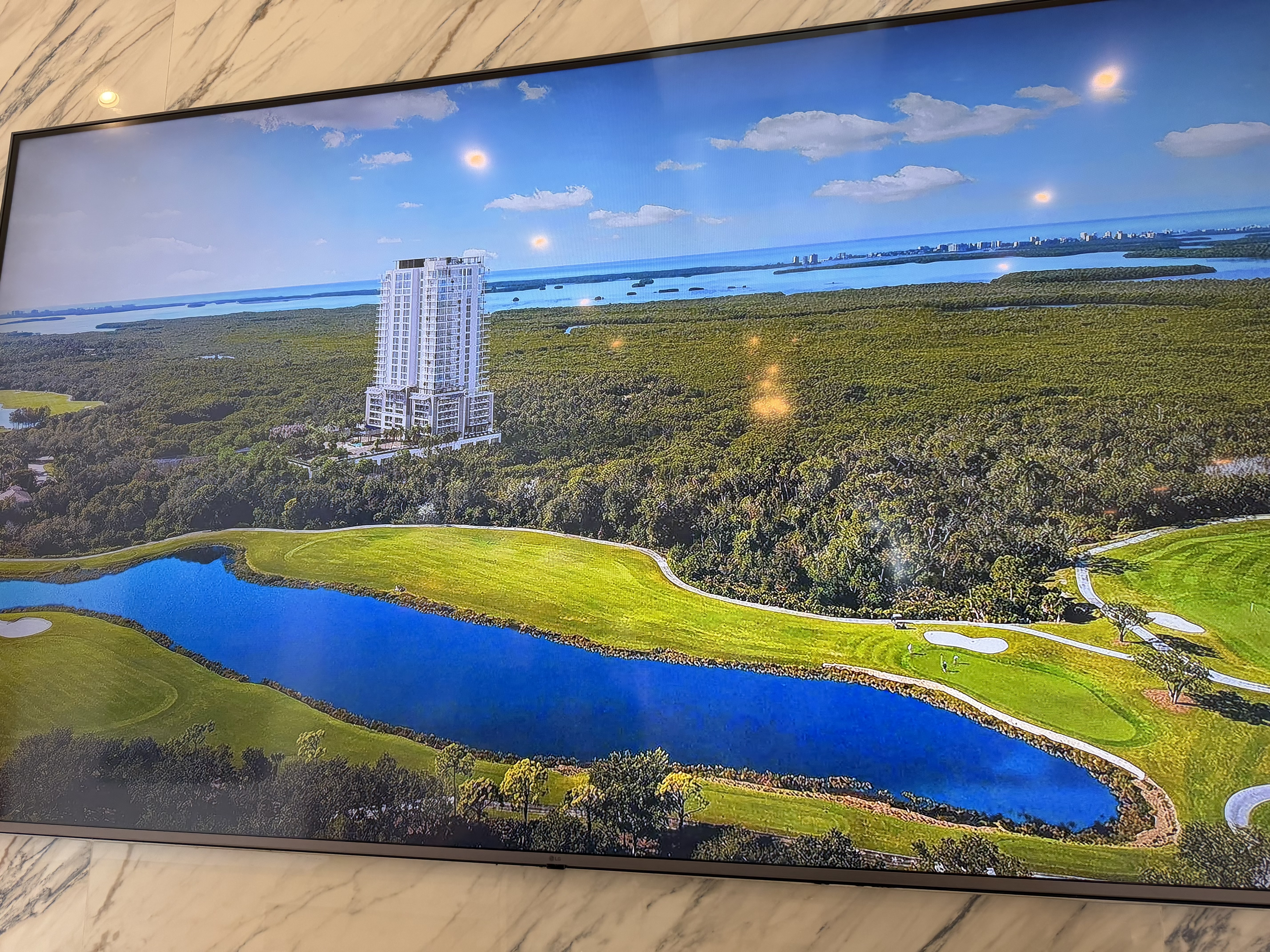Landscaped grounds and residential architecture at West Bay Club