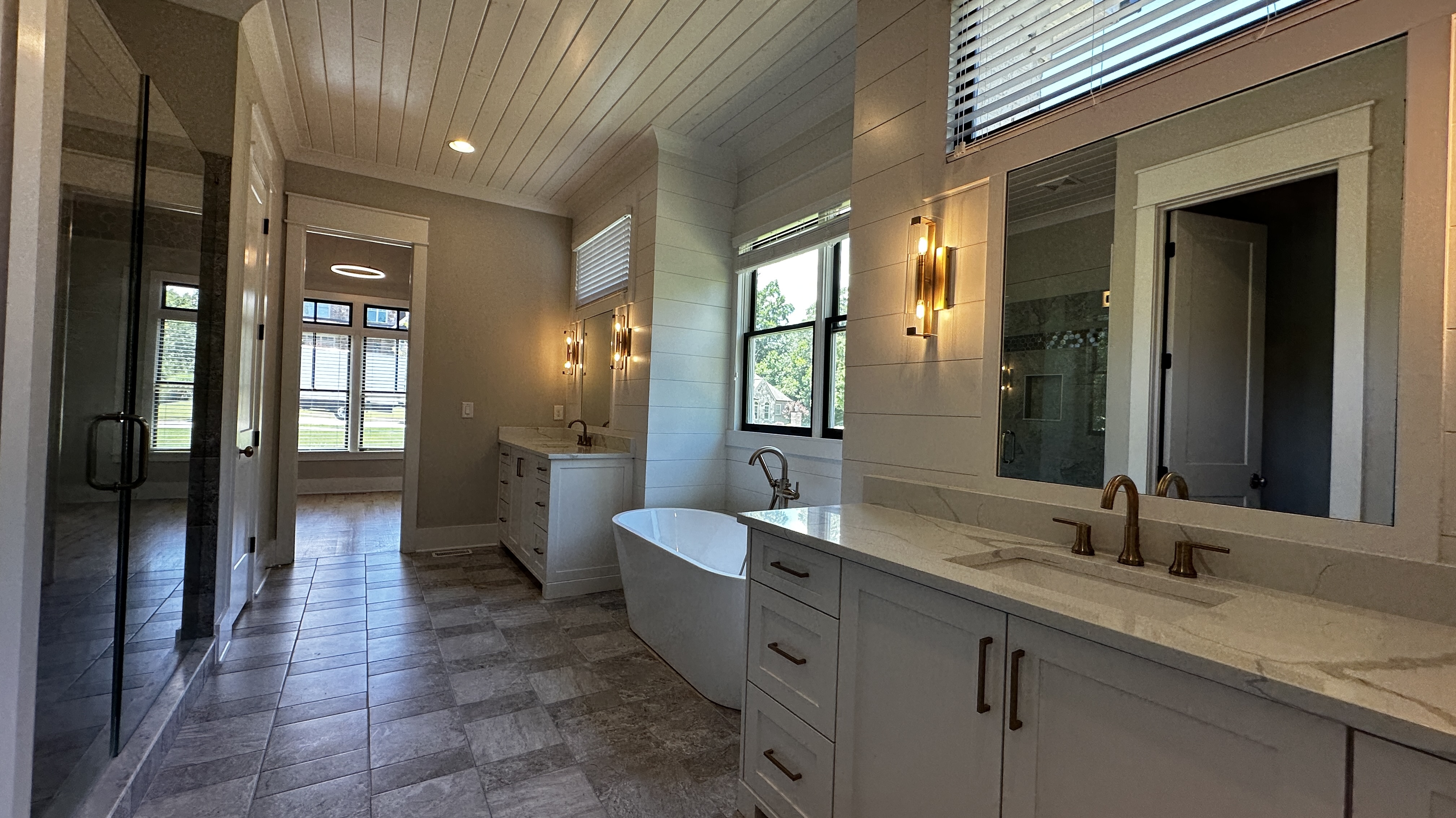 Bathroom at 5760 Lula Bridge Ct with double vanity and freestanding soaking tub