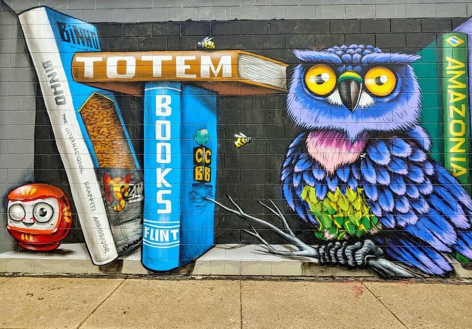 The welcoming storefront of Totem Books, an independent bookstore and cafe on West Court Street in Flint, Michigan