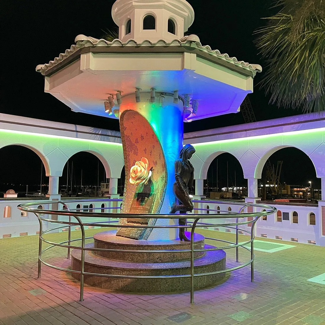 Mirador de la Flor, the Selena memorial on the Corpus Christi seawall, glowing with multicolored lights at night