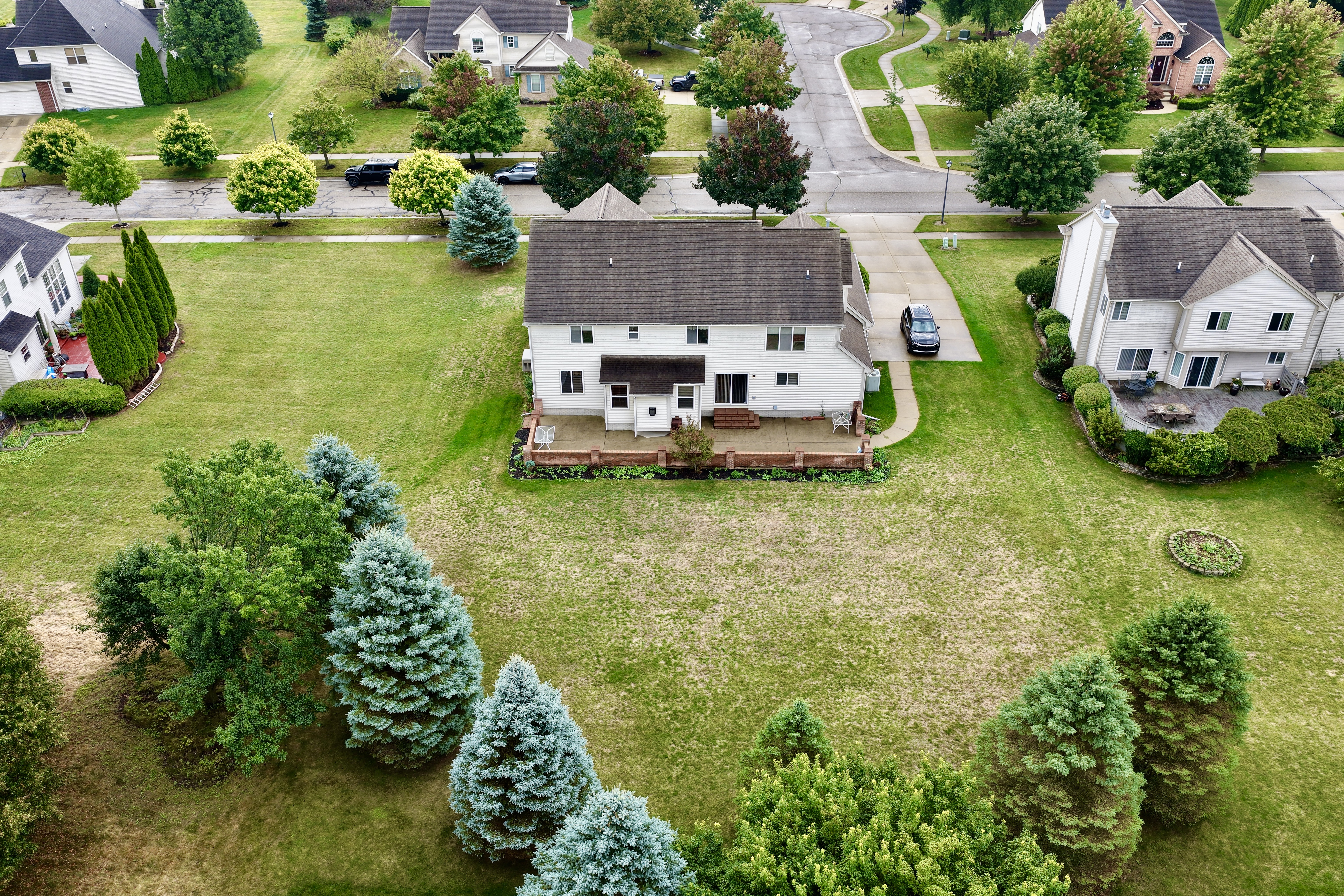 Drone view of the property at 2295 Hidden Forest Drive, Grand Blanc, Michigan
