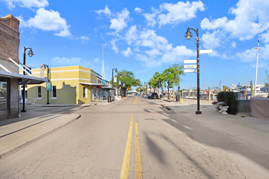 Dodecanese Boulevard at the Sponge Docks in Tarpon Springs, with waterfront restaurants and boats along the dock