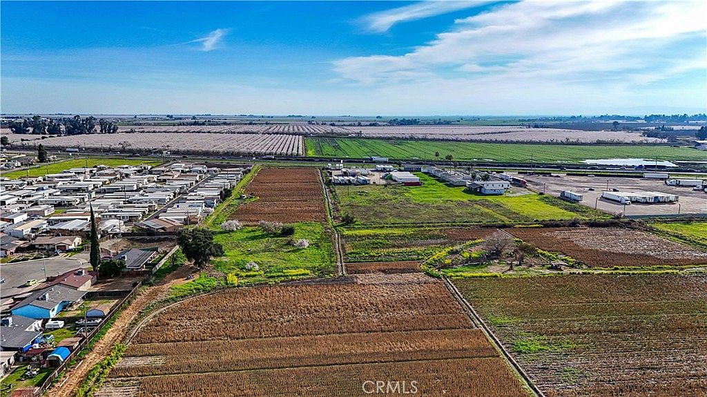 View of the property with agricultural crops in the foreground