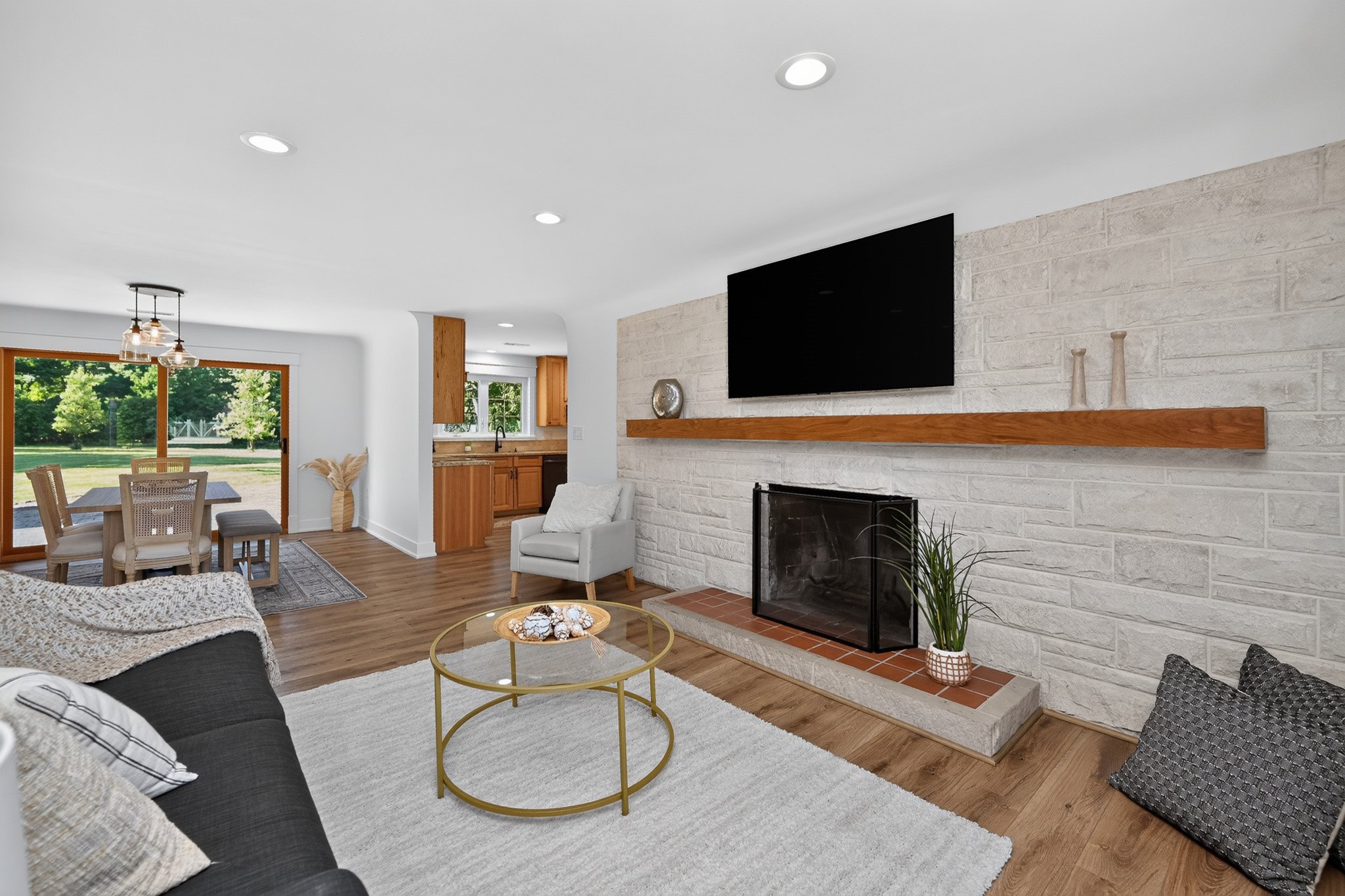 Staged kitchen with warm wood accents and open shelving