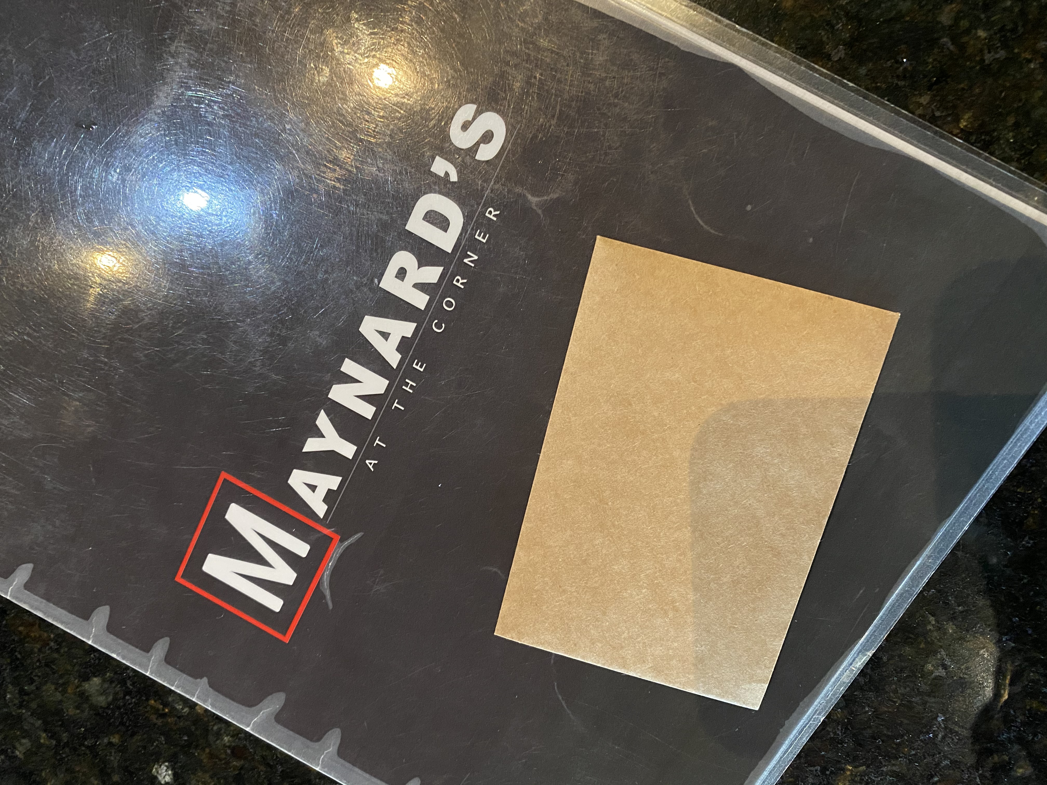 Menu cover at Maynard's at the Corner BBQ restaurant in Flowery Branch Georgia