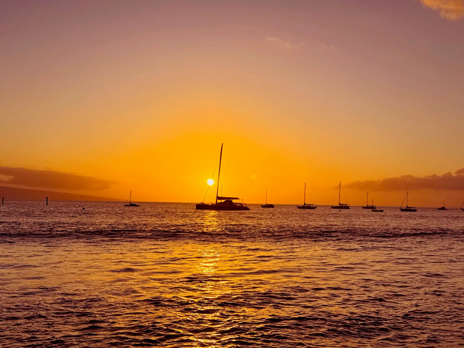 Sunset view over Lahaina with warm golden light over the harbor