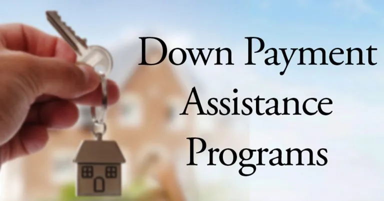 A hand holding a house-shaped keychain with a 'Down Payment Assistance Programs' tag, representing the down payment assistance programs available to Corpus Christi and Coastal Bend homebuyers