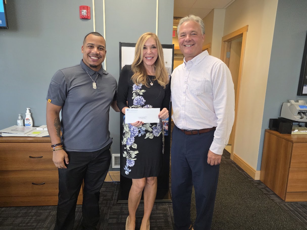 Northampton Area Konkrete Kids Educational Foundation representatives with a supporter of the foundation