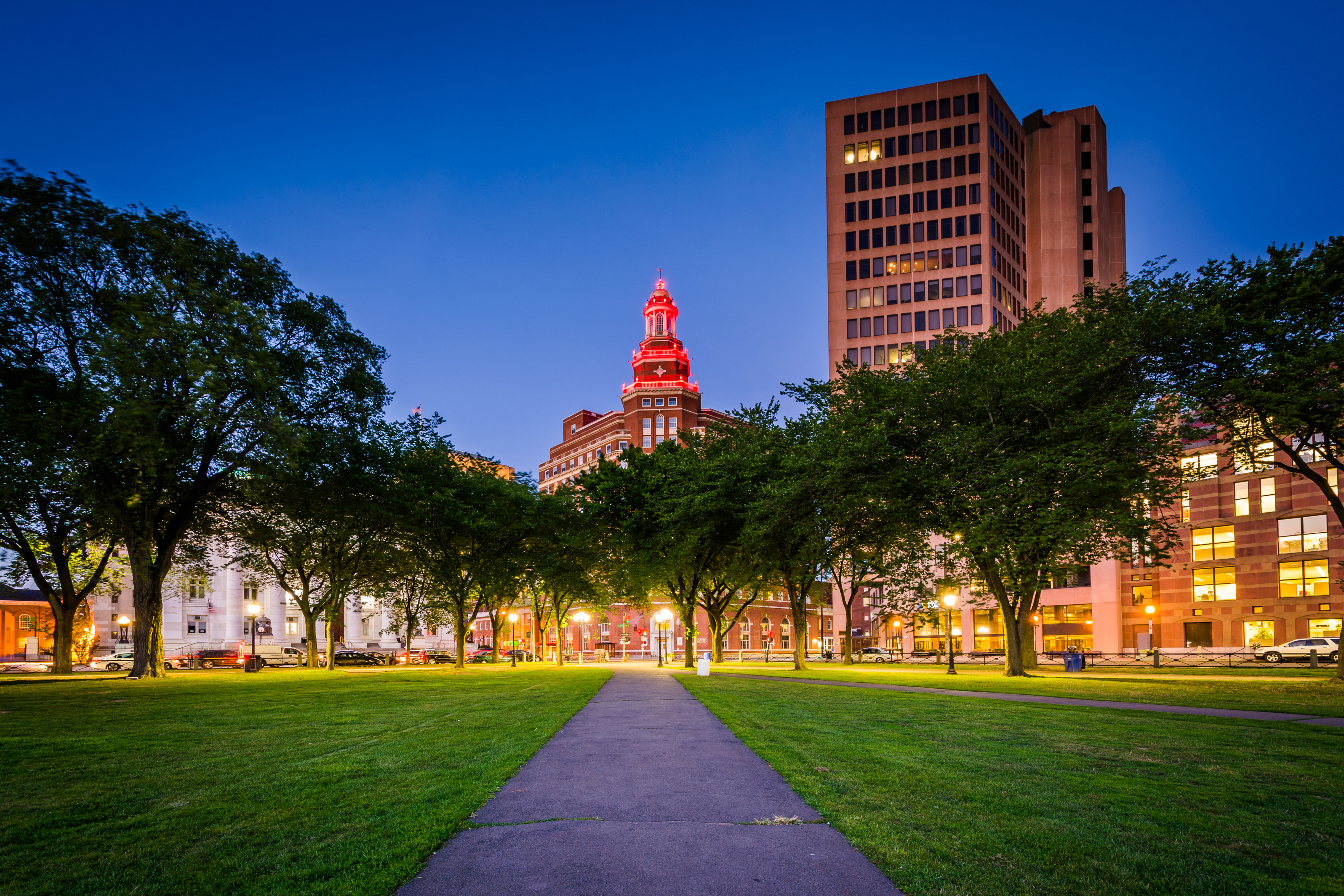 New Haven park pathway with city buildings in the background