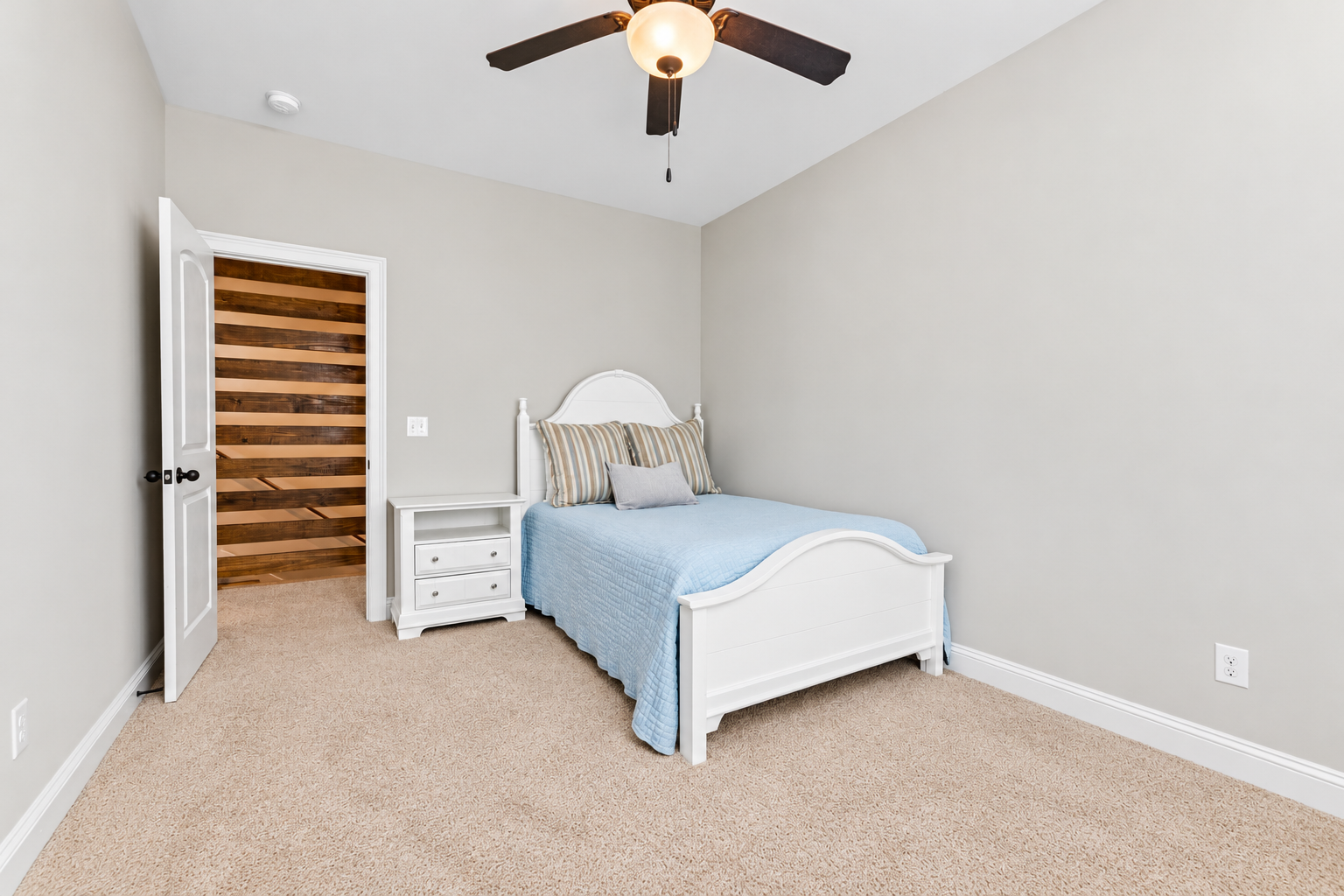 Bright coastal bedroom with blue accents at 1537 Dartmouth Dr, Auburn AL