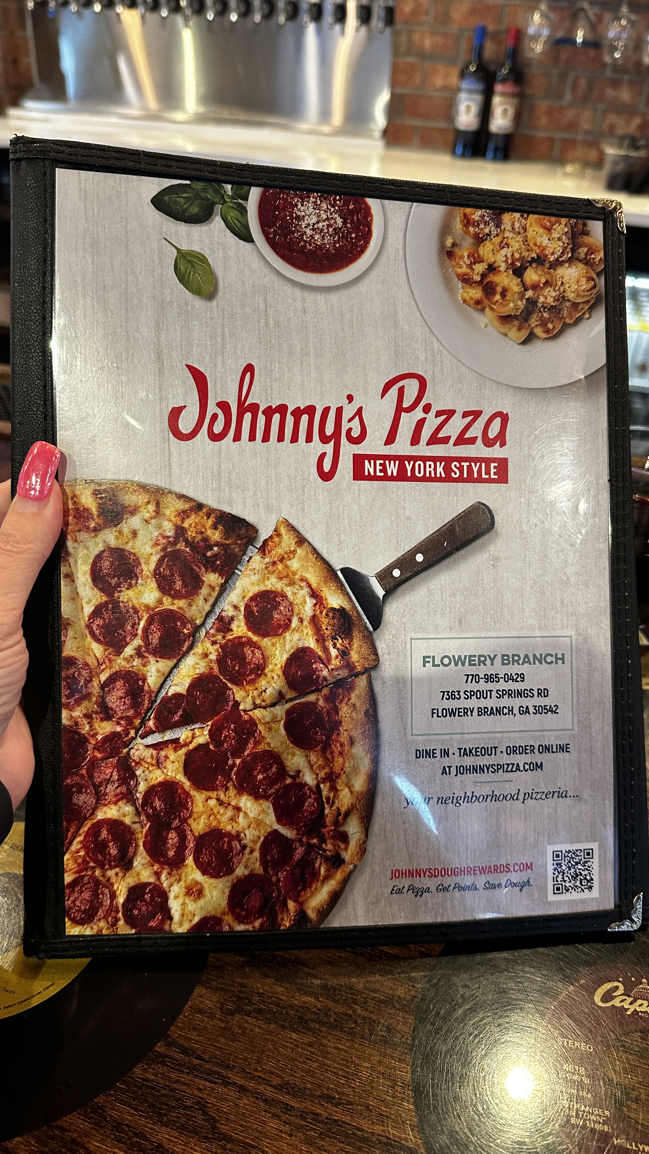 Johnny's Pizza restaurant storefront or dining area in Flowery Branch Georgia