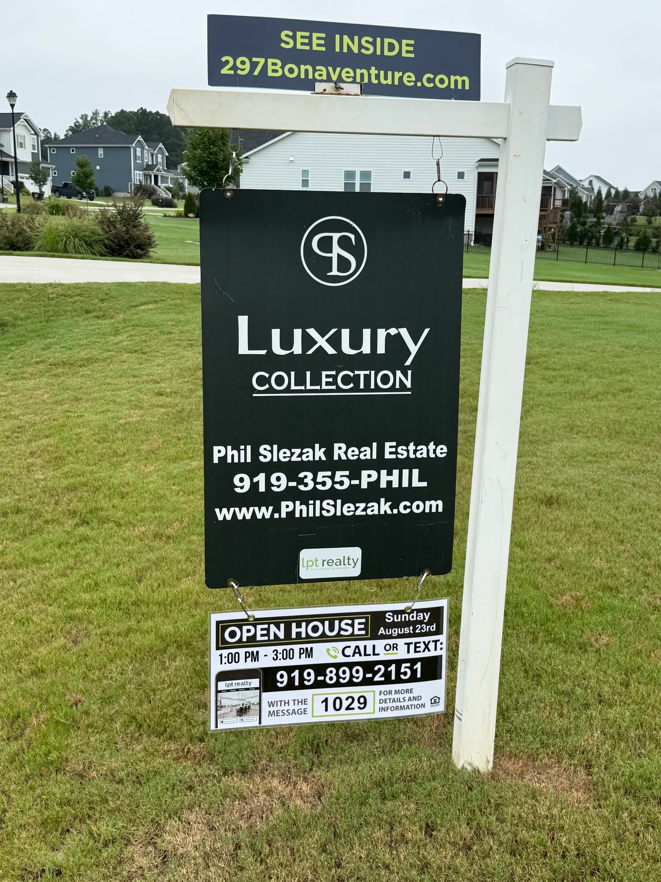 High-visibility yard sign for the 297 Bonaventure Dr listing featuring three interior color photos