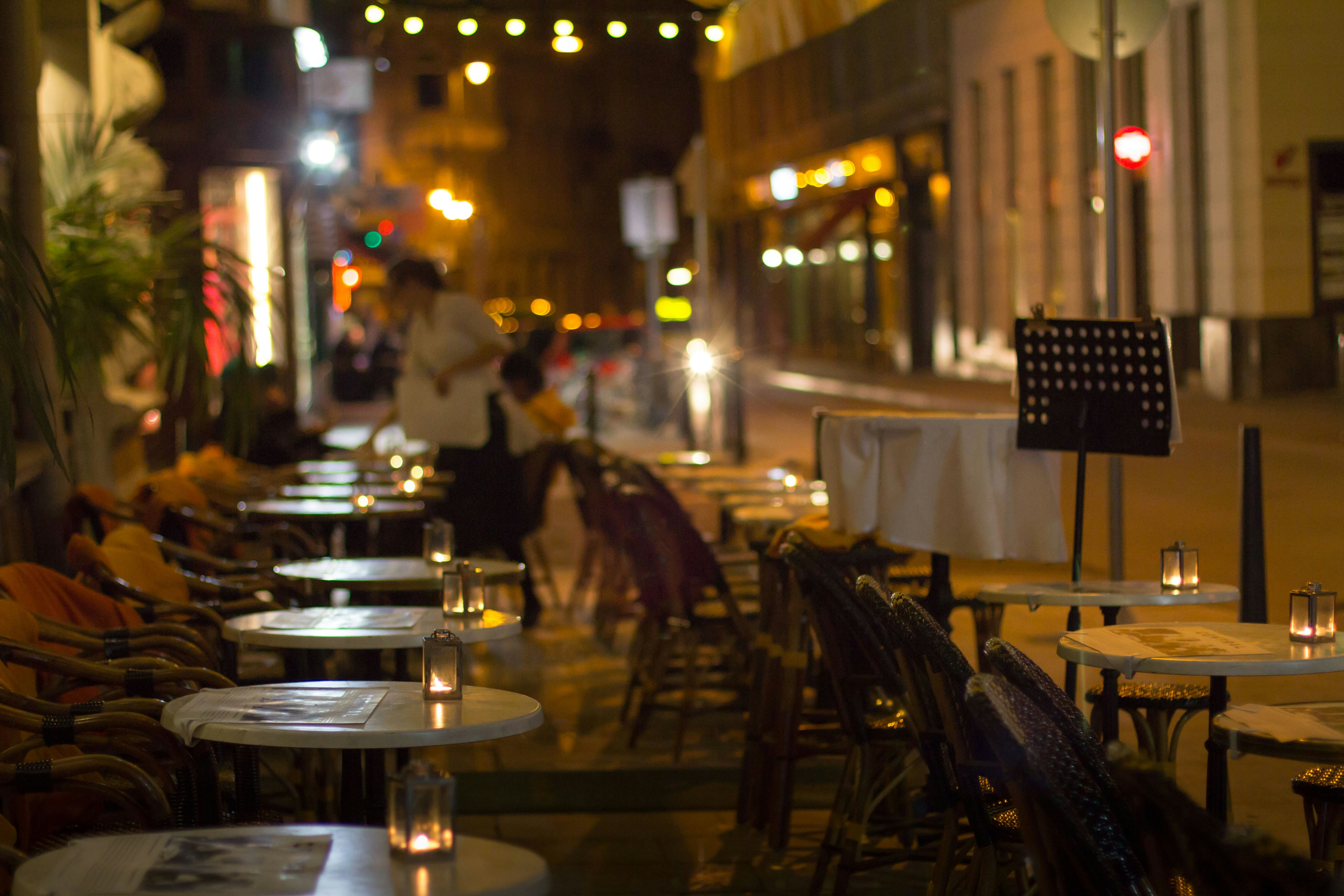 Elegant restaurant dining scene with beautifully set tables and warm ambient lighting