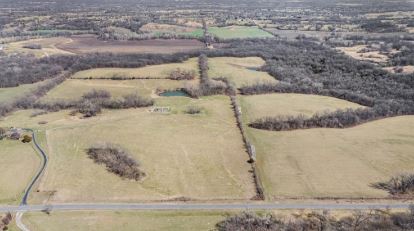 Aerial view of the 38.26-acre property in Holt, Missouri with rolling terrain and open pastures