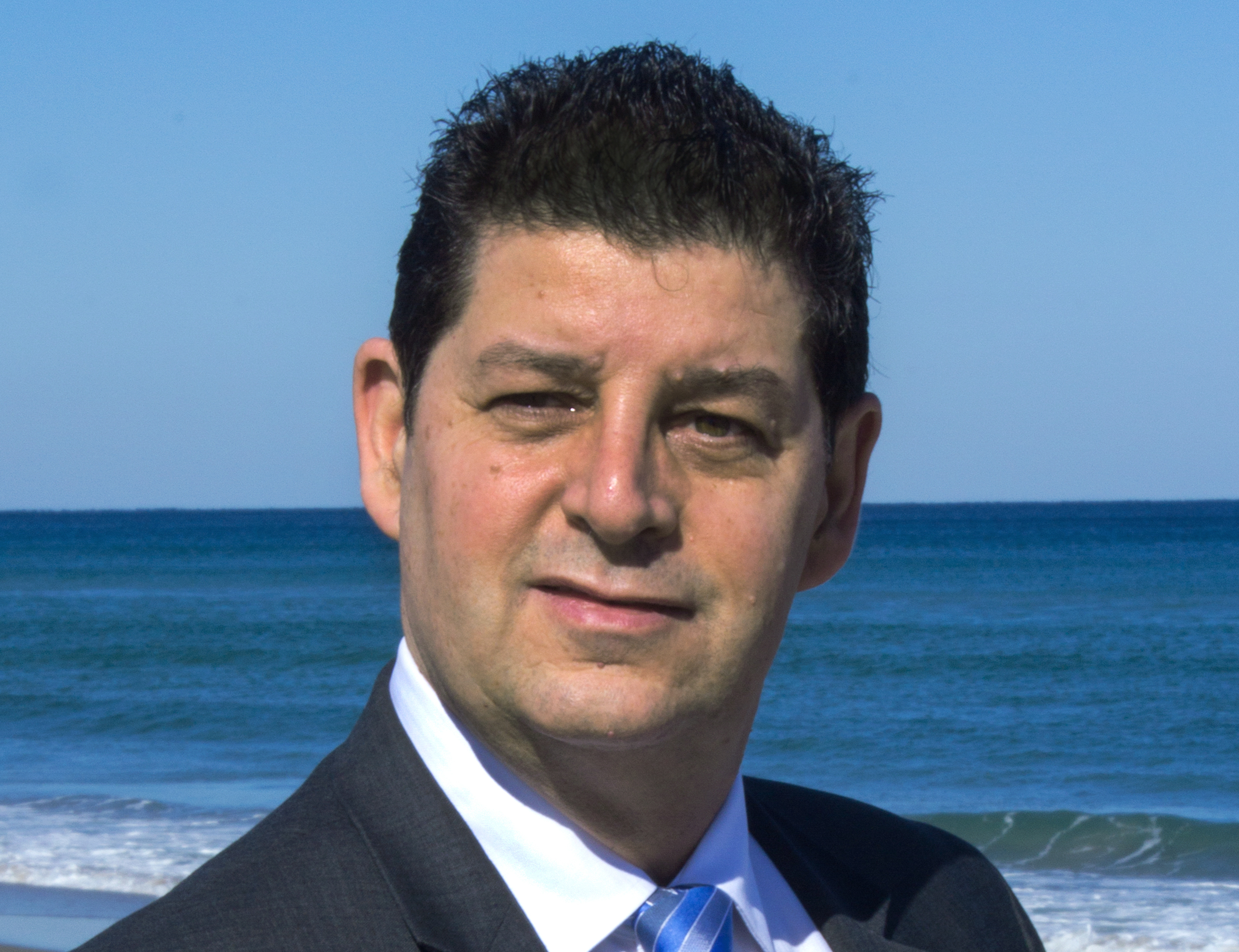 Professional headshot of Jean-Luc Andriot, luxury Realtor in Boca Raton