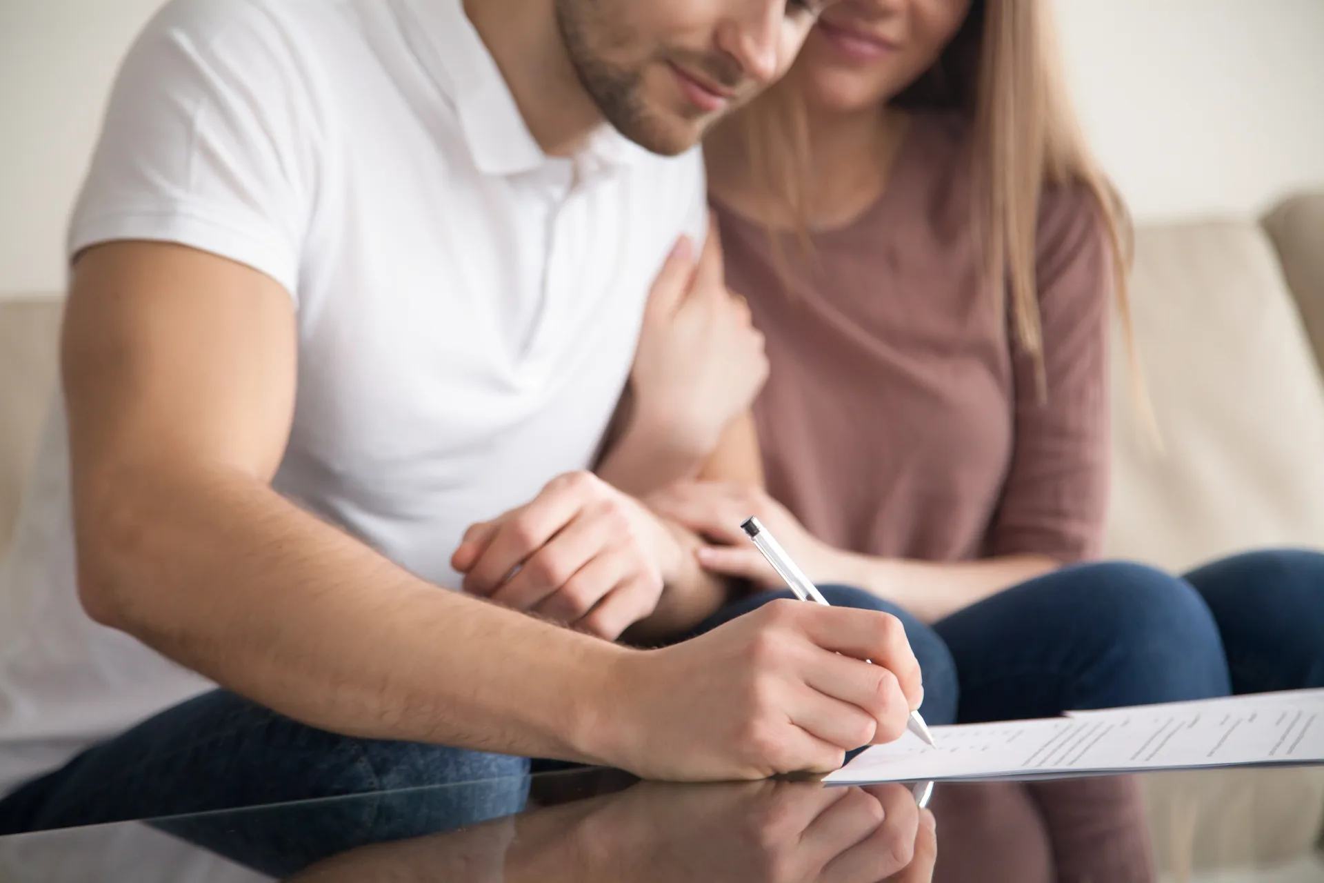 A couple reviewing home buying documents together