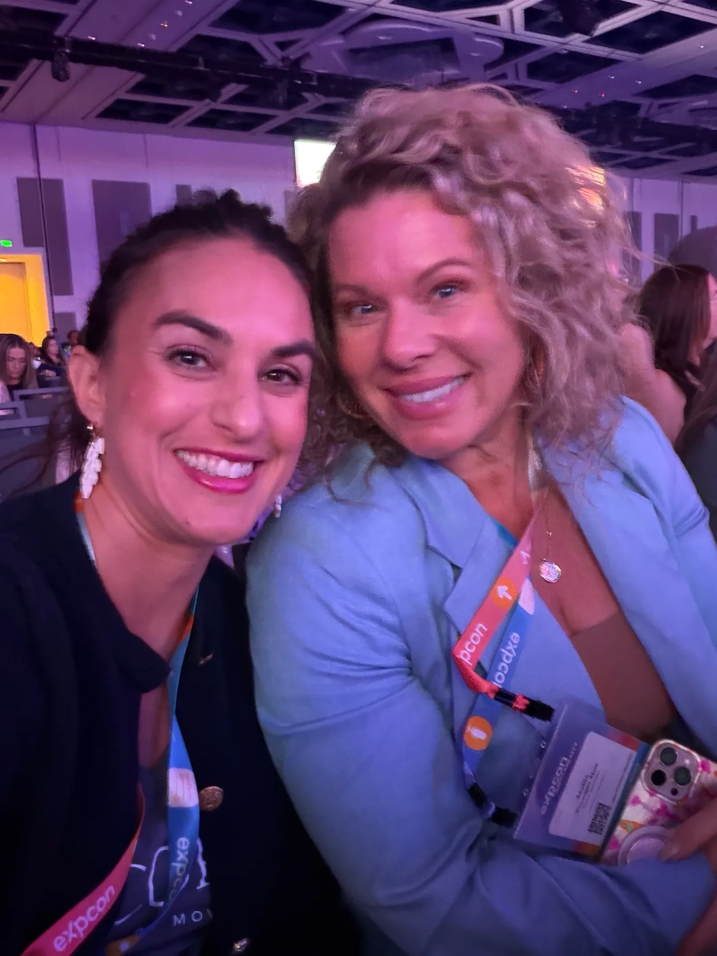 Two agents taking a selfie together at a national agent conference