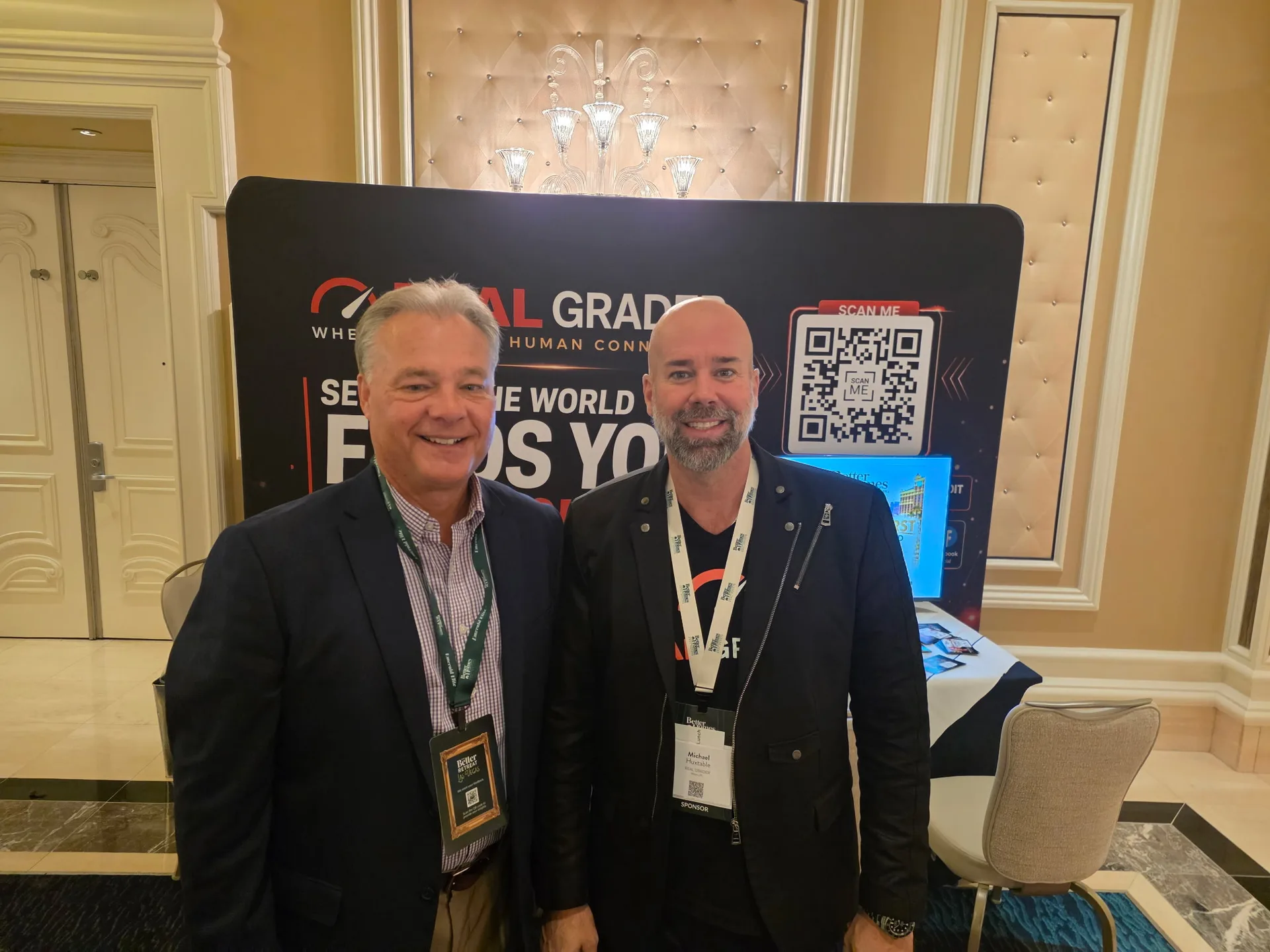 Two attendees stand at the Total Grader display at the Better Homes and Gardens Real Estate retreat