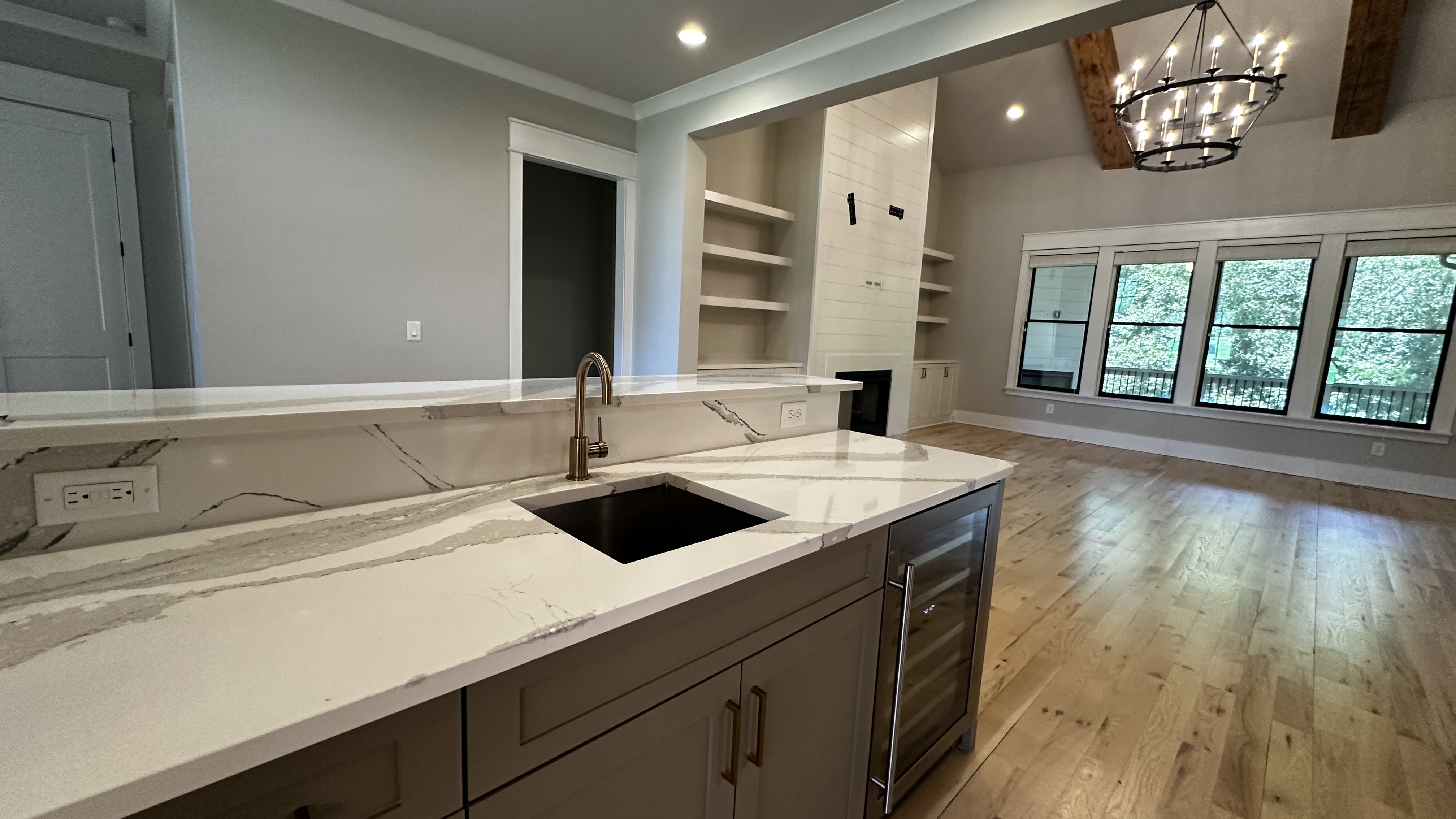 Covered and screened porch at 5760 Lula Bridge Ct with fireplace and shiplap