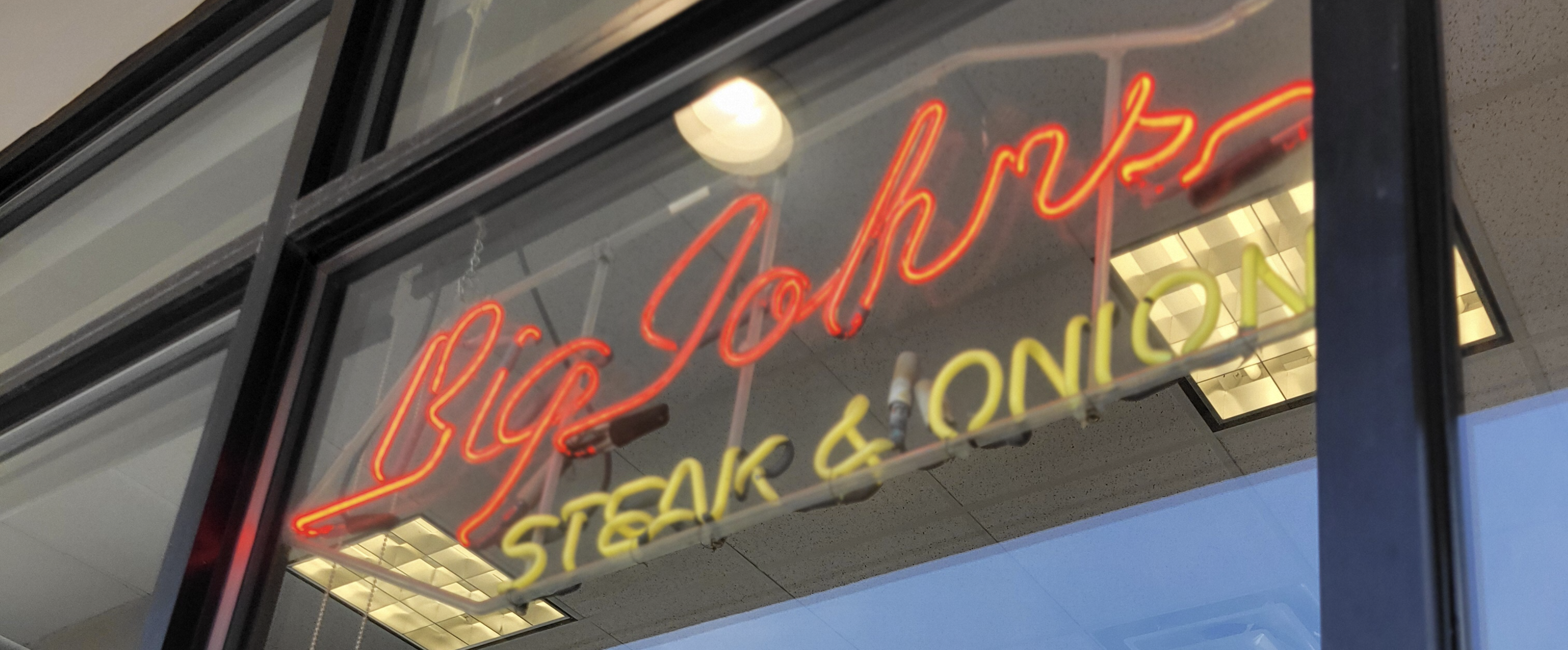 The iconic storefront of Big John Steak & Onion, a Mid-Michigan institution known for its signature steak and onion sandwiches