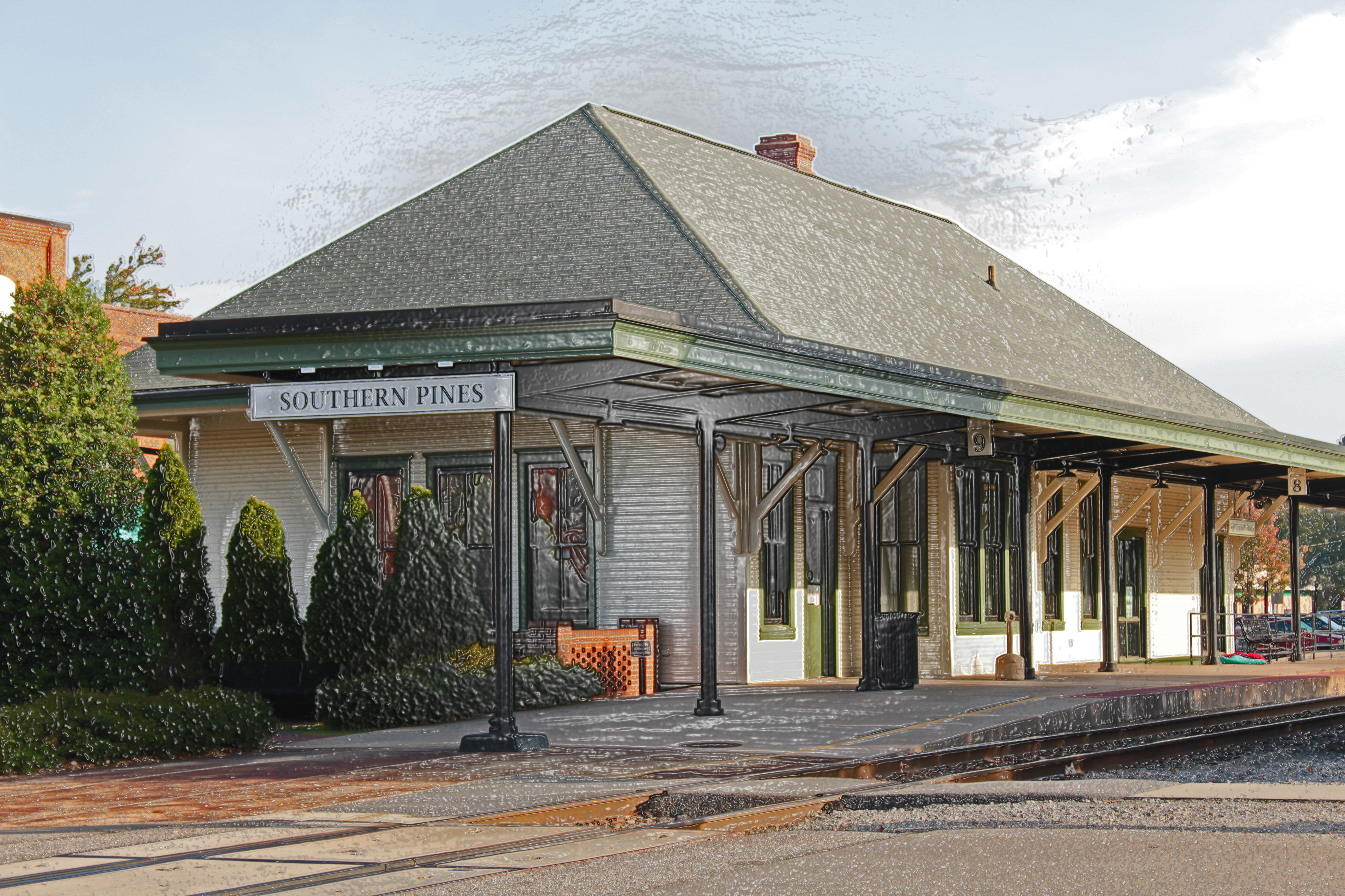 Southern Pines train station with a train at the depot platform