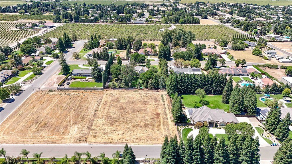 View of the building site at 1371 Shady Cove Ave with utility access points visible on the property