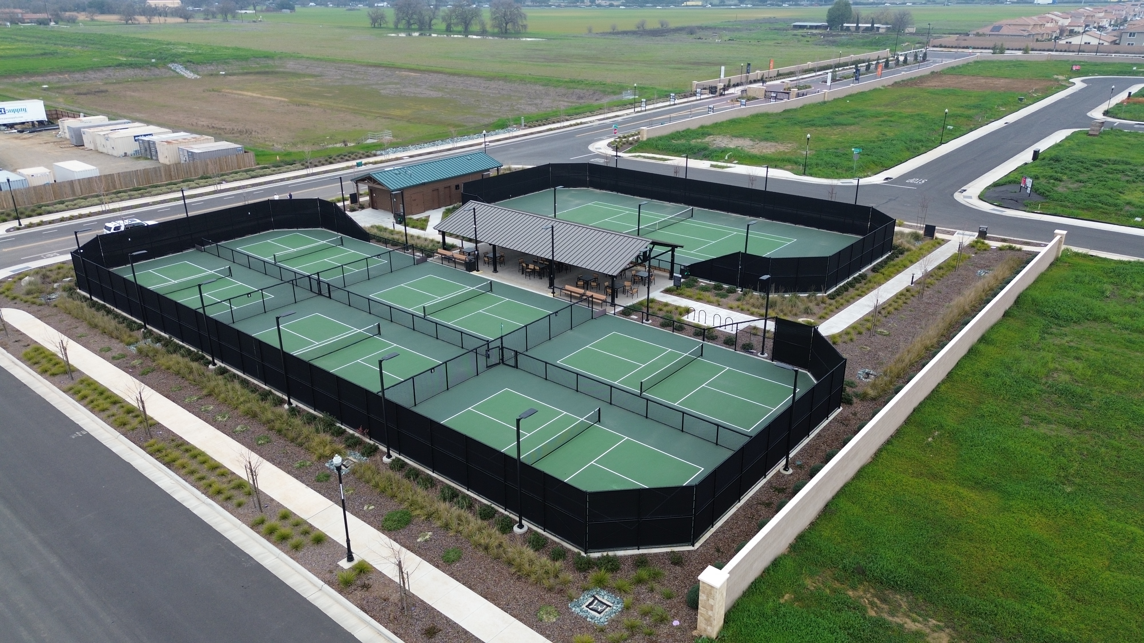 Aerial view of the pickleball court complex and surrounding development at Esplanade at Madeira Ranch in Elk Grove, California