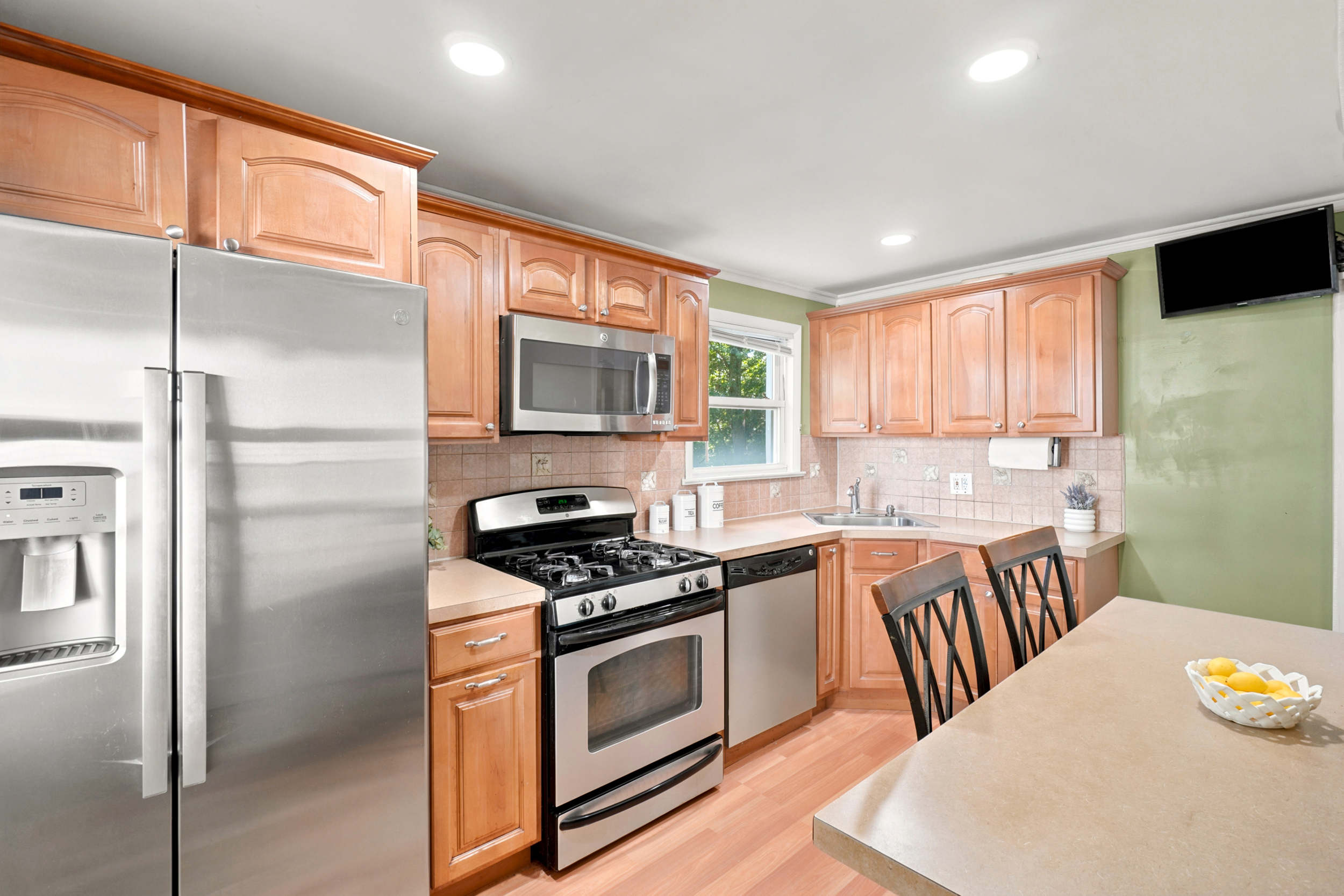 Eat-in kitchen at 50 Heather Ln with stainless steel appliances and light cabinetry