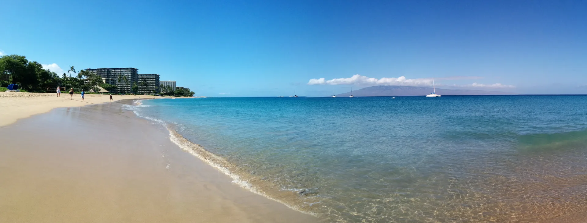 Pristine Maui beach at golden hour with turquoise water