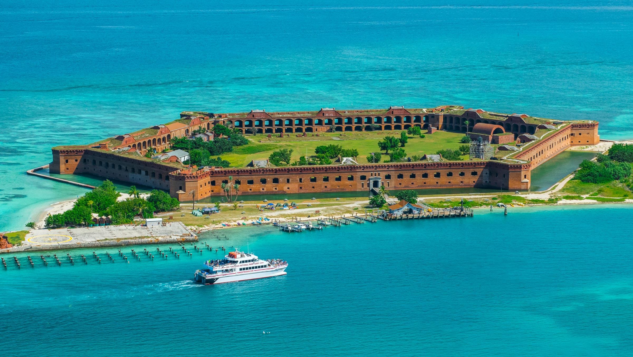 Pristine turquoise waters and coral reefs at Dry Tortugas National Park, the westernmost dive destination in the Florida Keys
